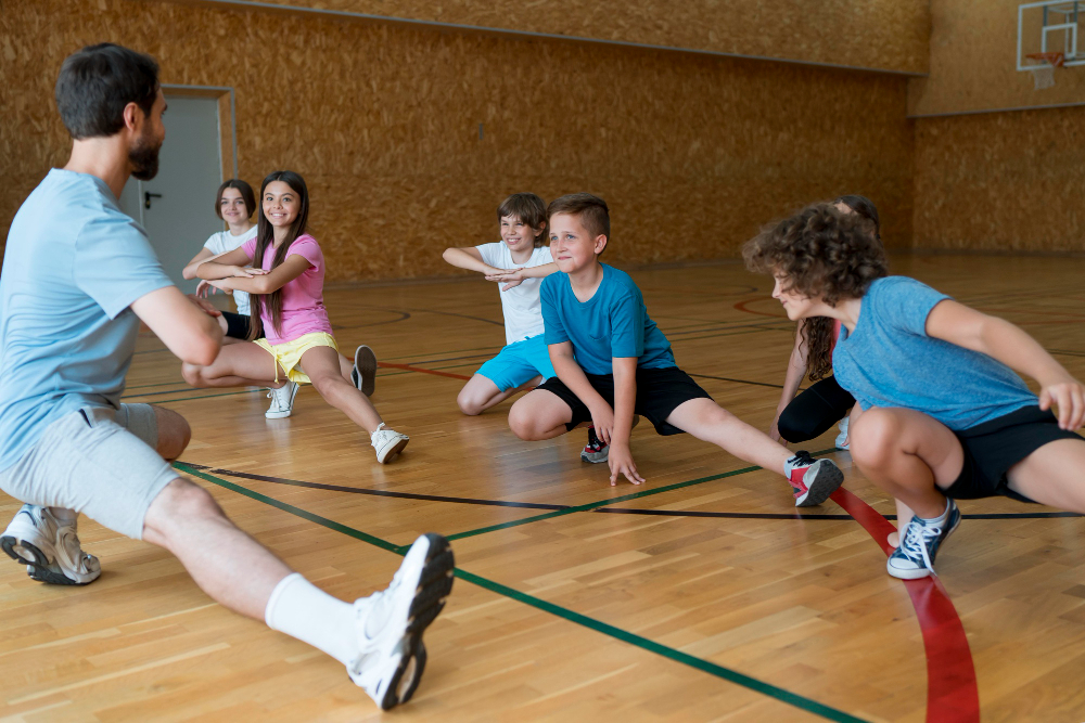 medium-shot-kids-exercising-in-school-gym.jpg